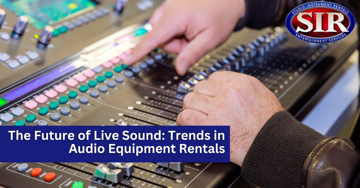 Audio engineer using a digital mixing console at a live event for sound control.