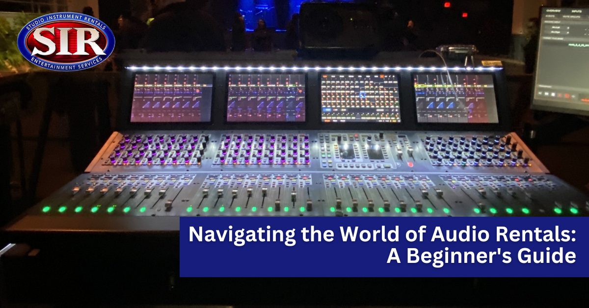 Audio rental equipment setup with a professional PA system and microphones.